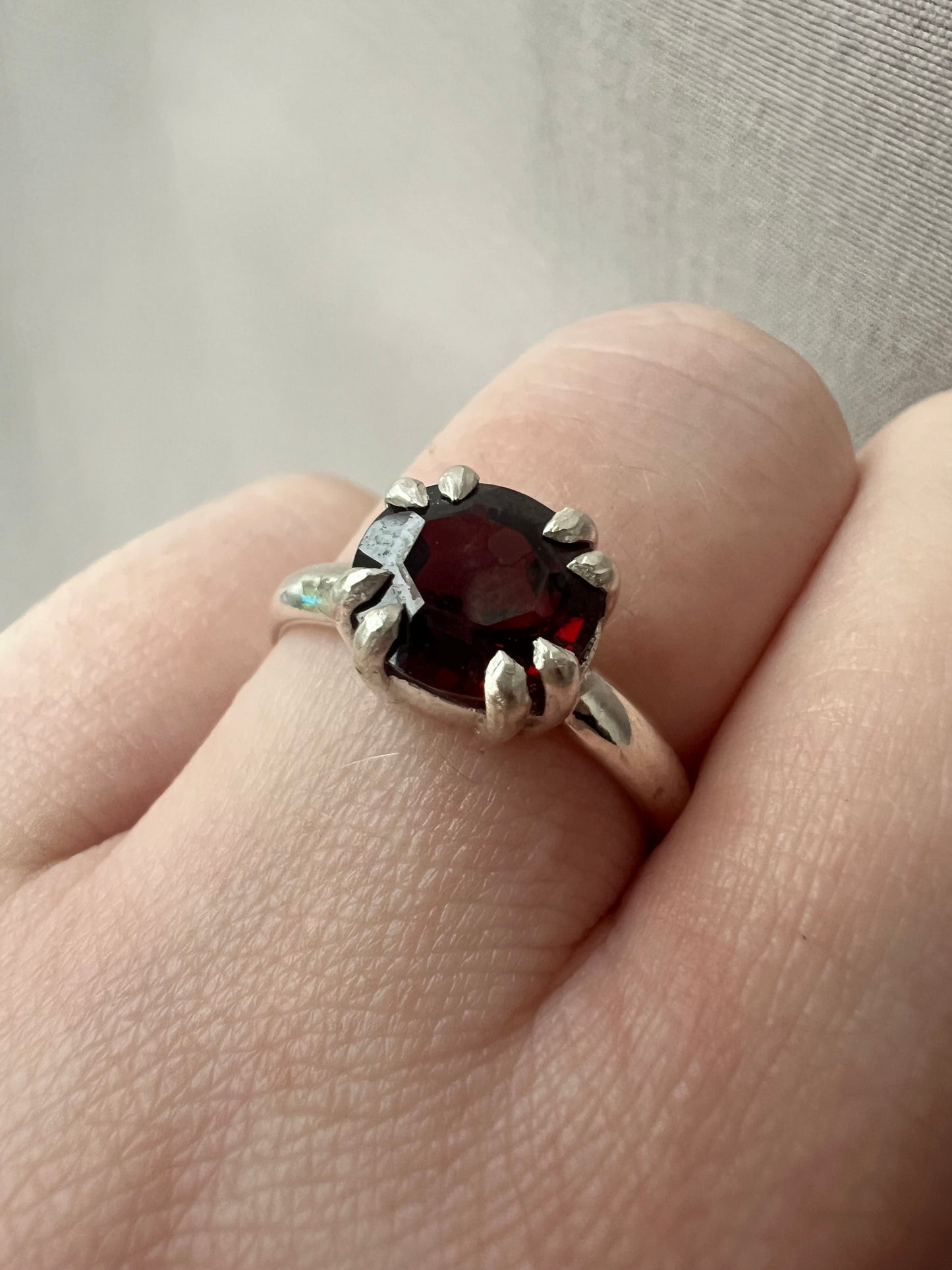 garnet oval double claw ring