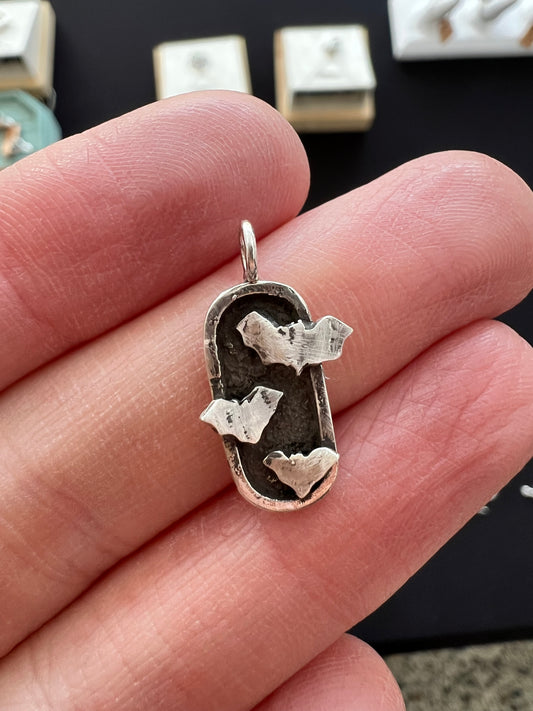 rounded rectangle triple bats necklace