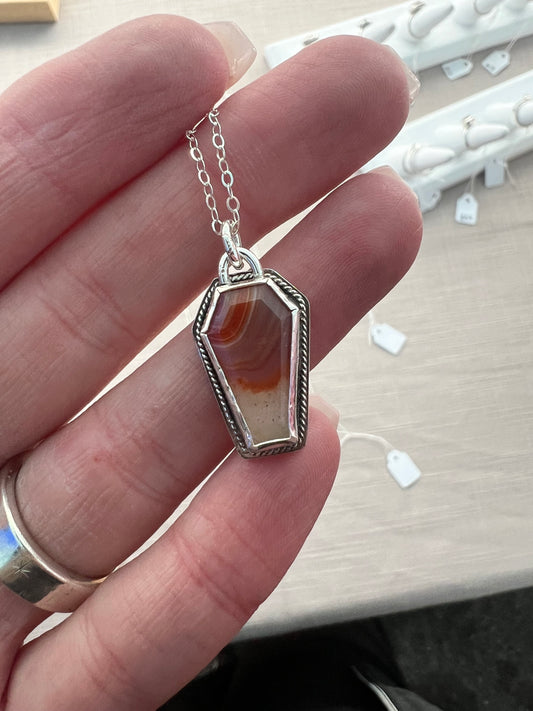 orange coffin necklace