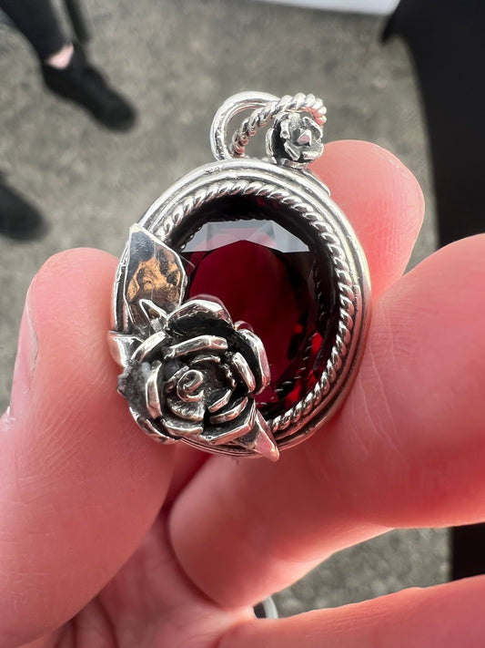 large garnet oval with handforged rose necklace